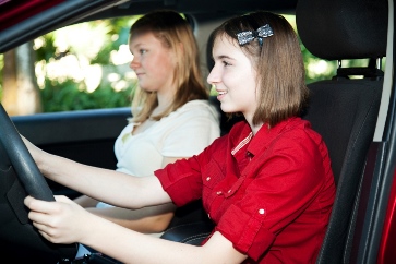 teen driving a car